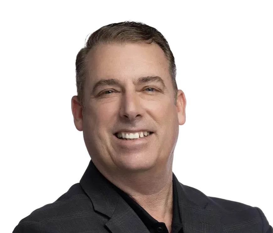 Headshot of Sean Patrick Murphy, Senior Vice President of Growth at eXp Realty, smiling in a dark blazer and shirt.